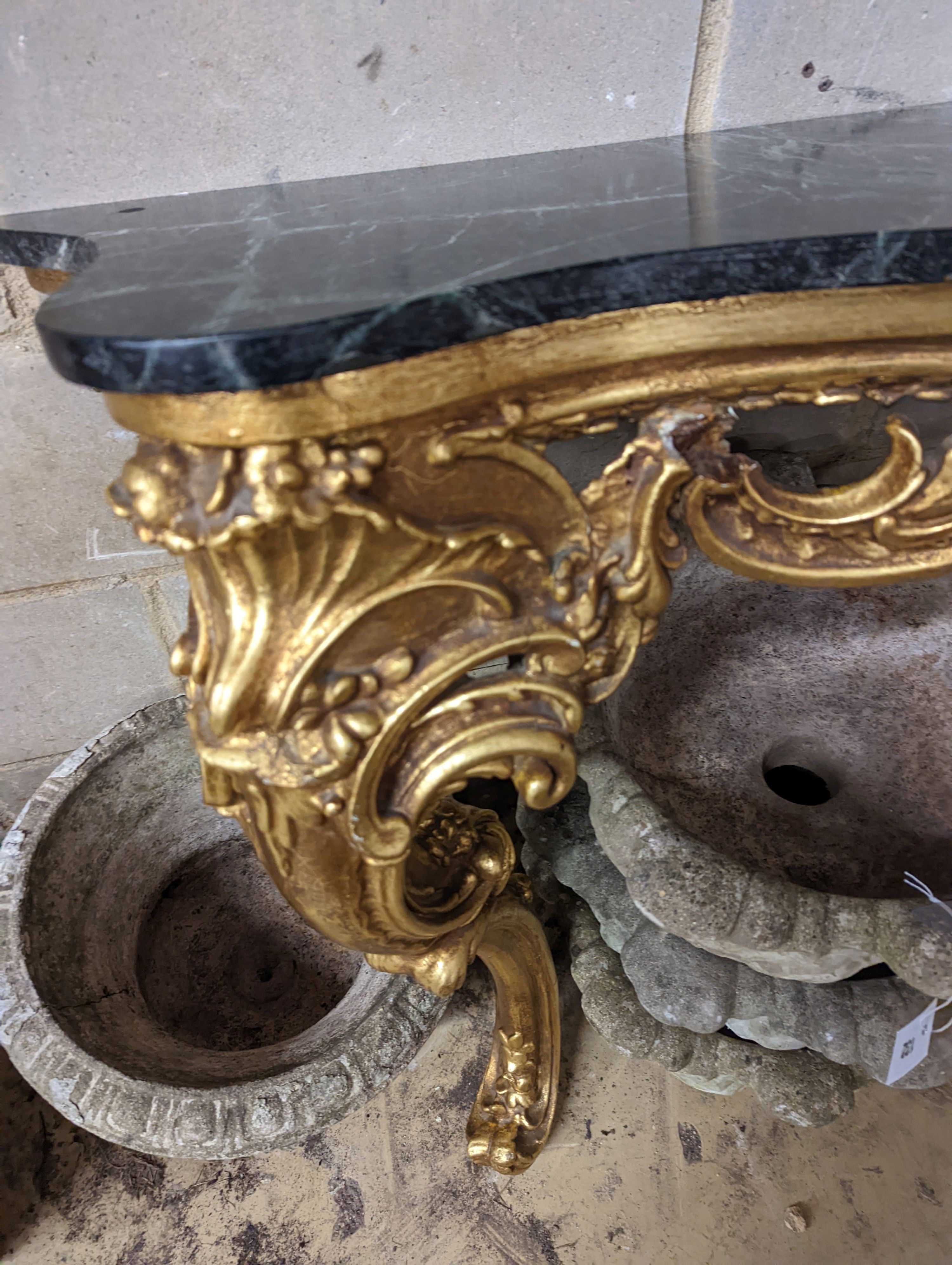 An 18th century style serpentine giltwood marble top console table, width 123cm, height 87cm